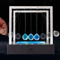 Pendule de Newton lumineux